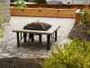 Paleo paver patio with outdoor fireplace and raised cedar bed - Seattle, Ecoyards.