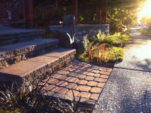 Steps and walls with tumbled retaining wall blocks